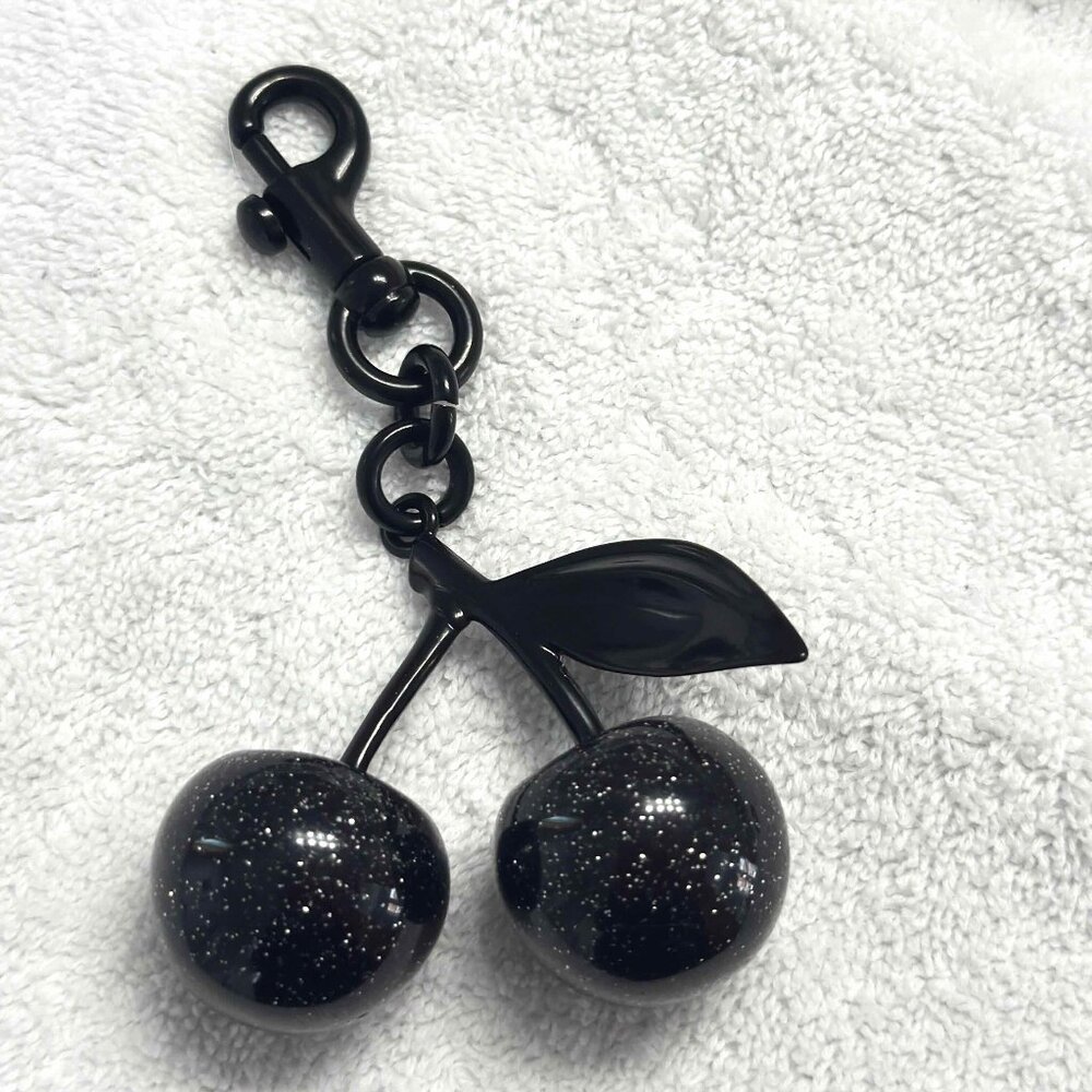 All black cherry charm.  Not Coach brand. Excellent condition.  Quick shipper.